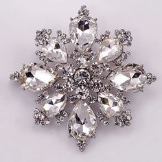 Gorgeous crystal rhinestone brooches made from sparkling tear drop and round crystal rhinestones. Metal base plated in silver color with safety pin back. Size: 2-3/4 inches wide. Wedding Brooches, Feminine Jewelry, Wedding Brooch, Antique Brooches, Cabochon Jewelry, Crystal Brooch, Pin Jewelry, Rhinestone Jewelry, Rhinestone Brooches