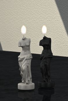 two candles that are sitting next to each other