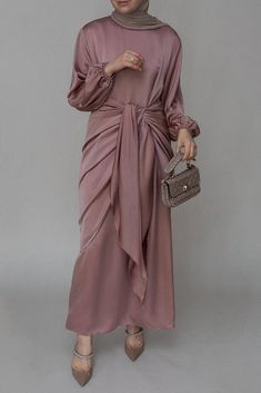 Ulaa maxi abaya dress with detached apron elasticated sleeve like tie waist piece in satin pink - ANNAH HARIRI Elegant Satin Maxi Abaya, Eid Satin Maxi Dress, Pink Long Maxi Dress For Eid, Elegant Pink Maxi Dress With Gathered Sleeves, Long Sleeve Pink Maxi Dress With Gathered Sleeves, Pink Long Sleeve Maxi Dress With Gathered Sleeves, Pink Satin Long Sleeve Maxi Dress, Modest Pink Maxi Dress For Party, Pink Satin Maxi Dress With Long Sleeves