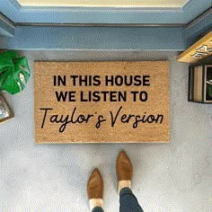 a door mat that says in this house we listen to taylor's version on it