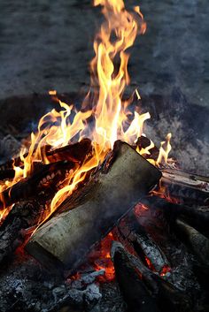 a close up of a fire with flames coming out of it