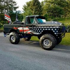 a black truck with an american flag painted on it