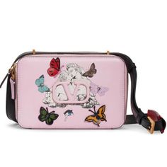 Sold Out. Brand New. Dreamy And Delightful, This Rosy Calfskin Shoulder Bag Gets The Garavani Treatment With A Signature Print, Leather Logo And Fluttering Butterfly Appliques. Inside, A Stamped Motto Reads 'We Can't Escape What Keeps Us Dreaming'-Making For A Marvelous Secret Touch. Secret Touch, Fluttering Butterfly, Valentino Crossbody, Valentino Garavani Bag, Valentino Handbags, Leather Saddle Bags, Crossbody Tote Bag, Signature Print, Leather Logo