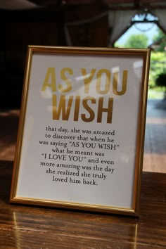 a sign that says as you wish on the table in front of a wooden table