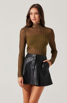 Faux leather pleated mini skirt Fully lined Concealed zipper with hook closure Dry clean only Self: 55% Polyurethane, 45% Cotton / Lining: 100% Polyester Style #ACS9201 Leather Pleated Mini Skirt, Faux Leather Pleated Skirt, Leather Pleated Skirt, Vacation Looks, Black Xs, Spring Tops, Pleated Mini Skirt, S Models, Pleated Skirt