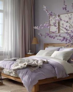 a bedroom with purple walls and white bedding