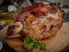 a whole chicken on a wooden cutting board