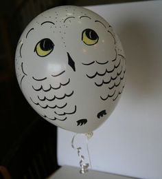 a white balloon with an owl design on it