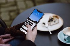 a person is using their cell phone to take a picture of the food on the table