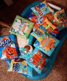 a blue bowl filled with lots of different types of snacks