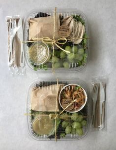 two plastic containers filled with food on top of a table