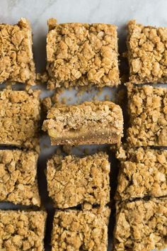 homemade granola bars cut into squares on a sheet of parchment paper