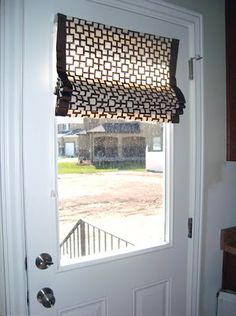 an open door with a window covering the outside