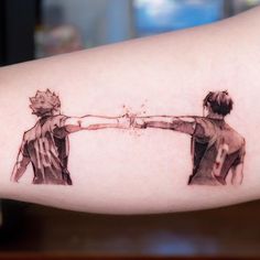 two people holding each other's hands with watercolors on their arms and arm