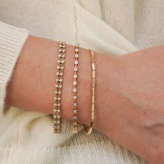 Every bracelet stack needs a solid gold option to add texture and that signature bold gold shine. We love the Melody Eden Gold Bar Bracelet for delivering on the substantial gold look with a lightweight feel and attainable price point. The stations are comprised of high-shine 14k karat gold and are hollow, so they never feel heavy, and the semi-fixed design means this station bracelet wears like your favorite cuff. With an adjustable length, this gold bracelet has everything you need for your growing bracelet collection. 14 Karat Gold Adjustable Length 6.5-6.75 Inches 2.4mm in Width Need Sizing help?Size Guide Lobster Clasp Gold Bar Bracelet, Dana Rebecca Designs, Station Bracelet, Diamond Stacking Rings, The Melody, Bar Bracelet, Kids Bracelets, Buddha Pendant, Bridal Engagement Rings