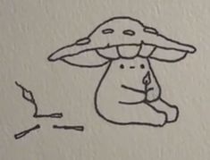 a drawing of a mushroom sitting on the ground