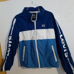 Nwt. Shell Is 100% Nylon. Lining Is 100% Polyester. Never Worn. Never Used. Please Ask Any Questions Prior To Purchase. No Remorseful Buyers Please. No Returns. Blue Nylon Track Jacket For Fall, Levi's Blue Outerwear For Fall, Levi's Casual Blue Outerwear, Casual Blue Levi's Outerwear, Levi's Blue Outerwear With Pockets, Levi's Spring Blue Outerwear, Levi's Blue Spring Outerwear, Levi's Blue Outerwear For Streetwear, Half Zip Windbreaker