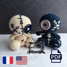 two crocheted stuffed animals sitting next to each other on a table with an american flag in the background