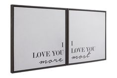 two black and white framed canvases with the words i love you more next to each other