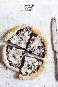 a blueberry pie is cut into four pieces