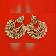 The Golden Jhumkas, Meticulously Crafted, Exude Timeless Allure, Capturing The Essence Of Tradition. The Addition Of Delicate Pearls Adds A Touch Of Grace And Refinement, Creating A Harmonious Balance Between Opulence And Subtlety. Whether You're Getting Ready For A Festive Occasion, A Special Event, Or Simply Want To Enhance Your Everyday Ensemble, These Jhumka Earrings With A Pearl Touch Are The Perfect Choice. With Every Sway, The Pearls Gently Reflect Light, Drawing Attention To Your Ears An Luxury Bollywood Jhumkas With Pearl Drop, Luxury Bollywood Chandbalis With Pearl Drop, Golden Jhumka Earrings, Golden Jhumka, Light Drawing, Dark Blue Earrings, Michael Kors Earrings, Betsey Johnson Earrings, Bling Earrings