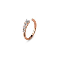 a rose gold ring with three stones