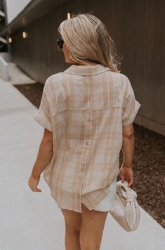 The Kali Light Beige Plaid Short Sleeve Top, a versatile staple that seamlessly blends comfort with style. Crafted from a soft taupe and white cotton fabric, this top embodies casual sophistication with a touch of classic charm. Featuring a timeless plaid print, the Kali top adds a hint of understated flair to your ensemble, making it perfect for both casual outings and more polished occasions. Its short sleeves provide just the right amount of coverage for warm weather, while the v-neckline wit Beige Plaid, White Cotton Fabric, Jumpsuit Shorts Rompers, Maxi Dresses Casual, Plaid Shorts, Short Jumpsuit, Romper Pants, Plaid Print, Spring Dresses