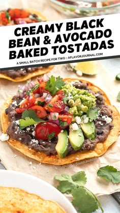 two tortillas with black beans and avocado on top