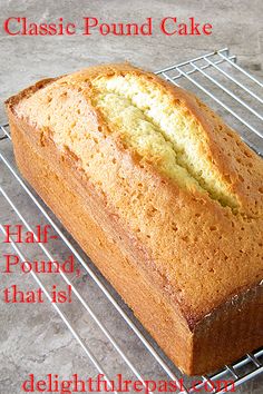 a loaf of bread sitting on top of a metal rack next to a wire rack