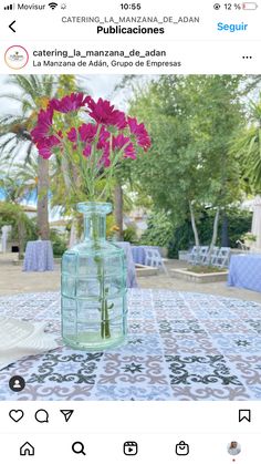 a vase with flowers in it sitting on a table