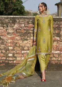 Elevate your style with our beautiful Green designer wear kurta kameez set, a perfect blend of tradition and contemporary elegance. The ensemble features a unique tulip pant and a tissue dupatta adorned with multiple color joints and pure gotta lace, adding a touch of sophistication to the overall look. The kurta is intricately designed with thread zardosi work on the flair, side slit, and boota work on the neck and sleeves, creating a stunning visual appeal. The gotta lace detailing enhances the richness of the attire, and pure pearls add a touch of glamour. The accompanying tulip pant complements the kurta flawlessly, providing a modern and chic silhouette. The tissue dupatta, with its vibrant color joints and pure gotta lace, adds a graceful finishing touch to the ensemble. This designe Event Attire, Party Wear For Women, Tulip Pants, Kurti Sets, Pakistani Formal Dresses, Pakistani Wedding Outfits, Pakistani Dresses Casual, Pakistani Fashion Party Wear, Hippy Chic