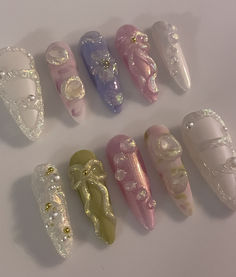 iridescent nails, fairy nails, fairycore, fairycore nails, ribbon nails, nails with 3d ribbon, 3d nail art, mix and match nails, pastel nails, 3d iridescent nails, Marie Antoinette Inspired Nails, Nice Nails Ideas, Puffy Nails, Weird Nail Ideas, Aesthetic Press On Nails, Ribbon Nails, Iridescent Nails, Asian Nails, Punk Nails