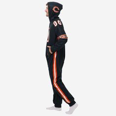 Turns out gameday is a great day for a pajama party. Just put on these Chicago Bears Gameday Ready One Piece Pajamas and see for yourself. You'll be ready for action, even if you're just laying on the couch. Features Onesie with zipper closure to keep you comfortable on the couch All-over gameday uniform design with team jersey accents that will have you looking ready to get in the game Team logo displays throughout, in case there were any doubts where your allegiances lie Jersey number accents, Casual Onesie With Letter Print For Game Day, Casual Onesie With Letter Print For Loungewear, Black Letter Print Sleepwear For Loungewear, Black Letter Print Sleepwear, Casual Sports Onesie With Letter Print, Casual Cotton Onesie For Sports Events, Casual Black Onesie For Loungewear, Casual Cotton Onesie For Game Day, Sporty Cotton Onesie For Loungewear