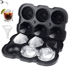 an ice cube tray with four cups and two spoons next to the same set