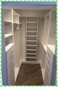 an empty walk in closet with lots of shelves and drawers on each side, along with wooden flooring