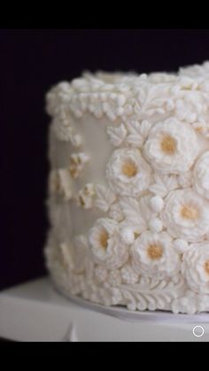 there is a white cake with flowers on it