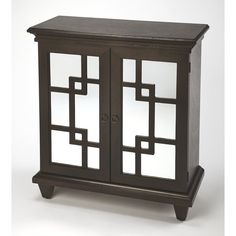 a wooden cabinet with glass doors on the top and bottom, in front of a white background