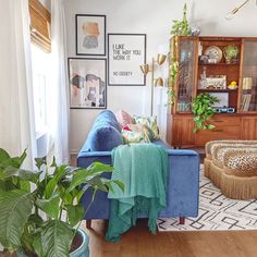 a living room filled with furniture and plants