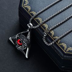 Embrace the mystery and symbolism of the Eye of Providence with this stunning necklace. The silver stainless steel chain is adorned with a vibrant red All Seeing Eye pendant, making a bold statement. Show off your unique style and embrace the power of this ancient symbol. We ship worldwide to 185 countries! Please allow 1-2 business weeks for your order to arrive. The Eye Of Providence, Eye Of Providence, Pendant Making, Seeing Eye, All Seeing Eye, All Seeing, Eye Pendant, Ancient Symbols, Pearl Strands