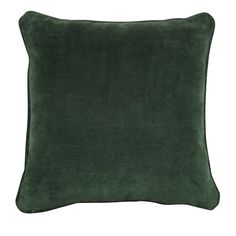 a dark green velvet pillow on a white background