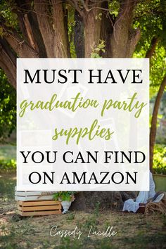 the words must have graduation party supplies you can find on amazon in front of a tree