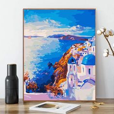 a painting on the wall next to a vase with flowers