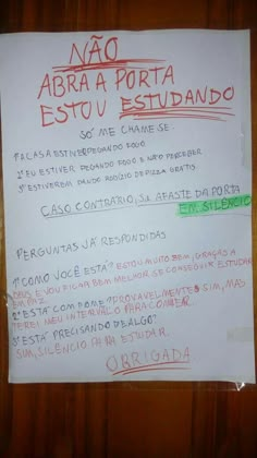 a piece of paper that has been placed on a wall with writing in spanish and english