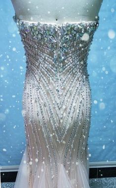 This is one of our nude strapless sheer dresses that is heavily beaded with Swarovski crystals. Sheer Dresses, Strapless Evening Gowns, Pastel Roses, Pageant Gowns, Bugle Beads, Pageant Dresses, Beauty Pageant, Fashion Website, Sheer Dress