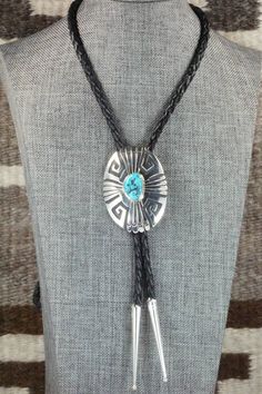 This turquoise and sterling silver bolo tie was made by Navajo silversmith Rosita Singer. The back is signed T&R Singer and stamped sterling.Tie Length: 22"Length: 2 3/8"Width: 1 3/4"Tips:Length: 2 1/8"Width: 1/4"Free shipping on all orders! We ship with USPS and always include tracking. All orders ship within a day of payment.Returns are accepted up to 30 days after you receive your order. Just send us a message. Our shop offers cash back or store credit. The item must be returned in new condit Artisan Lariat Jewelry For Rodeo, Western Sterling Silver Turquoise Necklace, Western Style Sterling Silver Turquoise Necklace, Silver Southwestern Lariat Necklace As Gift, Artisan Silver Lariat Bolo Tie, Western Style Lariat Jewelry With Concho, Southwestern Lariat Turquoise Necklace, Western Style Silver Turquoise Necklace For Ranch, Western Style Concho Lariat Jewelry