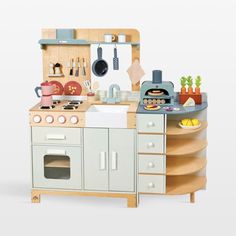 a child's play kitchen is shown in this image