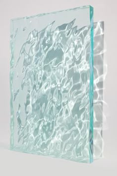 a glass block with water reflecting on it