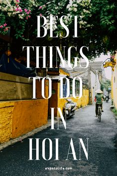 the words best things to do in hoi an, with a person on a bicycle