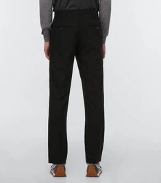 These Loewe pants are made in Italy from lightweight jet black wool and feature a straight-leg silhouette with crisp front creases..Belt loops.Made in Italy.Closure: zipper fly, button fastening.Designer color name: Black.Material: 100% wool.Care instructions: dry clean.True to size.Mid-weight material.Straight leg.High-waisted.Inseam length approx: 85cm-33.5'.The model in the picture is 185cm-6'1' and wearing a size 48 Semi-formal Black Wool Pants, Black Wool Pants For Semi-formal Occasions, Semi-formal Black Wool Bottoms, Black Wool Bottoms For Semi-formal Occasions, Tailored Black Pants With Concealed Placket, Black Pants With Concealed Placket For Business Casual, Black Pants For Business Casual With Concealed Placket, Black Wool Business Pants, Black Wool Pants For Business