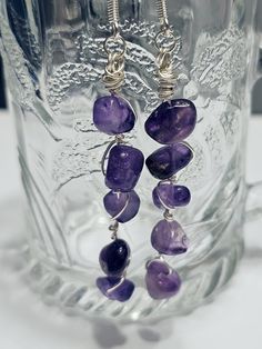 Unique handmade amethyst crystal drop dangle wire wrapped earrings. The length of earrings is approximately 61mm, lightweight.   Made of high quality synthetic amethyst beads and silver plated copper wire. Ear wires are made from silver plated stainless steel. Silicone earrings stoppers are included. To keep handmade jewellery in perfect condition please avoid contact with water or chemicals. Return policy: We accept returns. Please note, for hygiene reason jewellery can be returned only in unopened original pack and unused. Purple Wire Wrapped Long Drop Jewelry, Amethyst Wire Wrapped Drop Earrings, Handmade Amethyst Dangle Crystal Earrings, Handmade Amethyst Crystal Dangle Earrings, Amethyst Dangle Crystal Earrings With Natural Stones, Handmade Amethyst Teardrop Crystal Earrings, Amethyst Wire Wrapped Crystal Earrings As Gift, Amethyst Natural Stone Dangle Crystal Earrings, Purple Wire Wrapped Drop Earrings